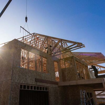 Trusses being installed on a house